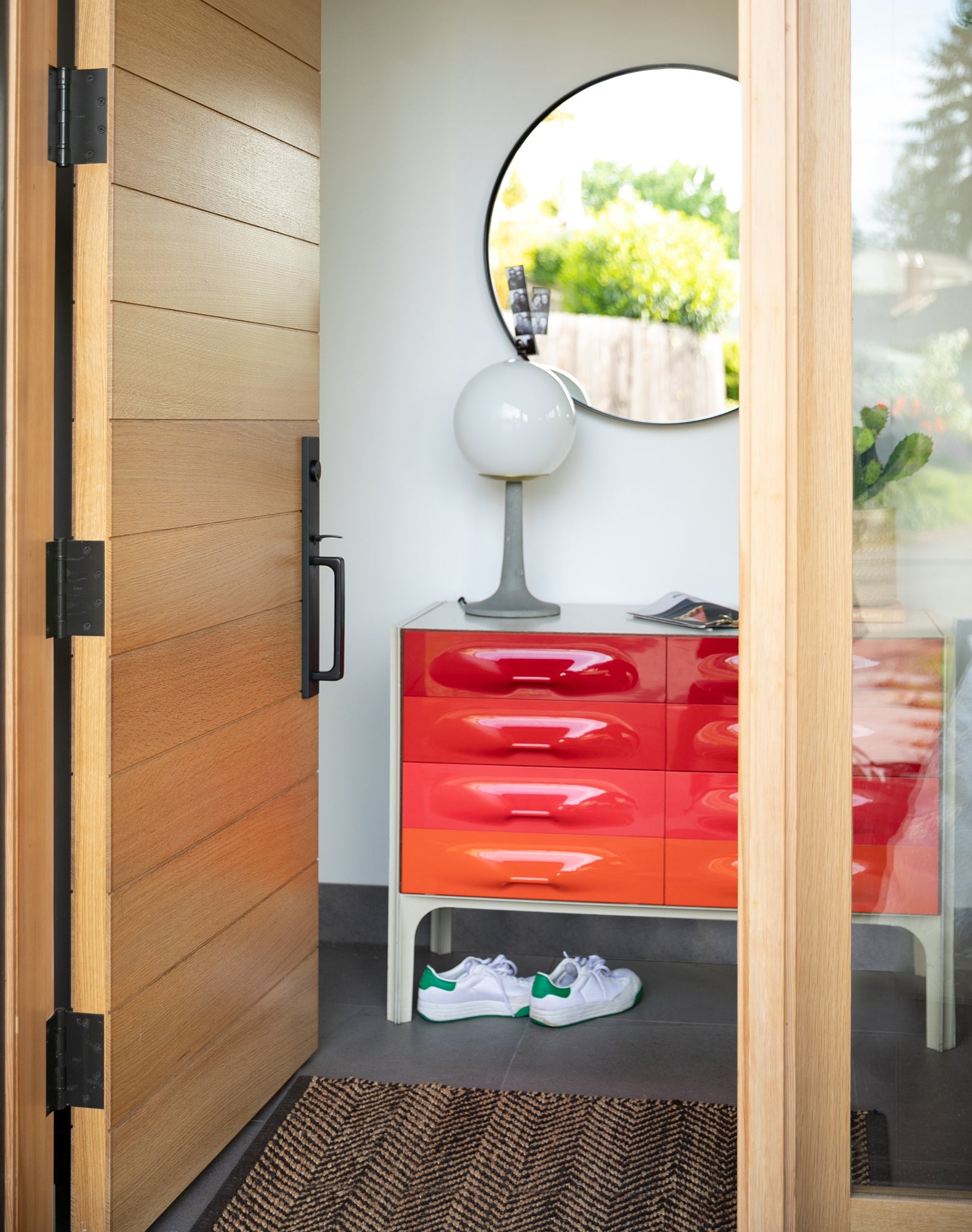 wooden door and round mirror