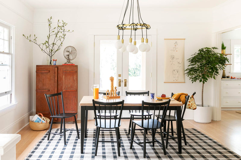 The Eddy chandelier over a dining table.