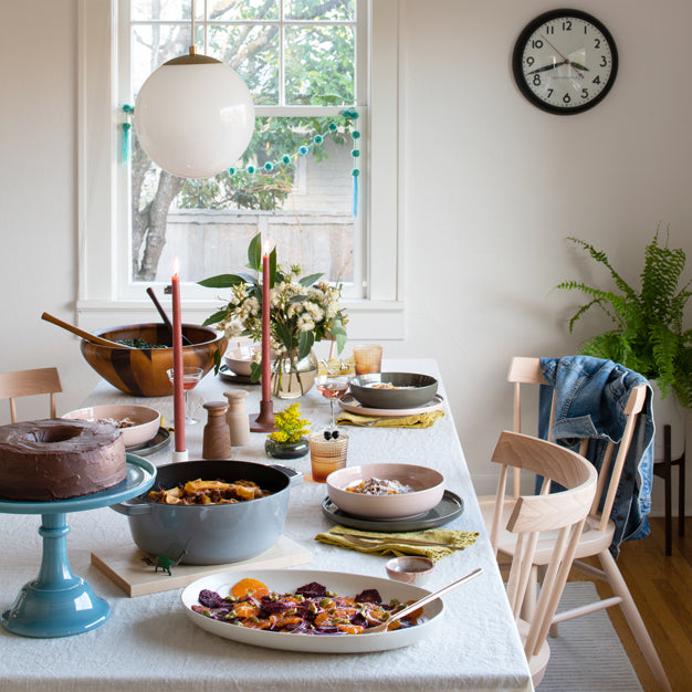 Kitchen table with food and candles on top