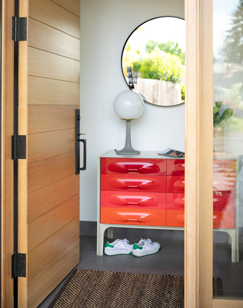 wooden door and round mirror