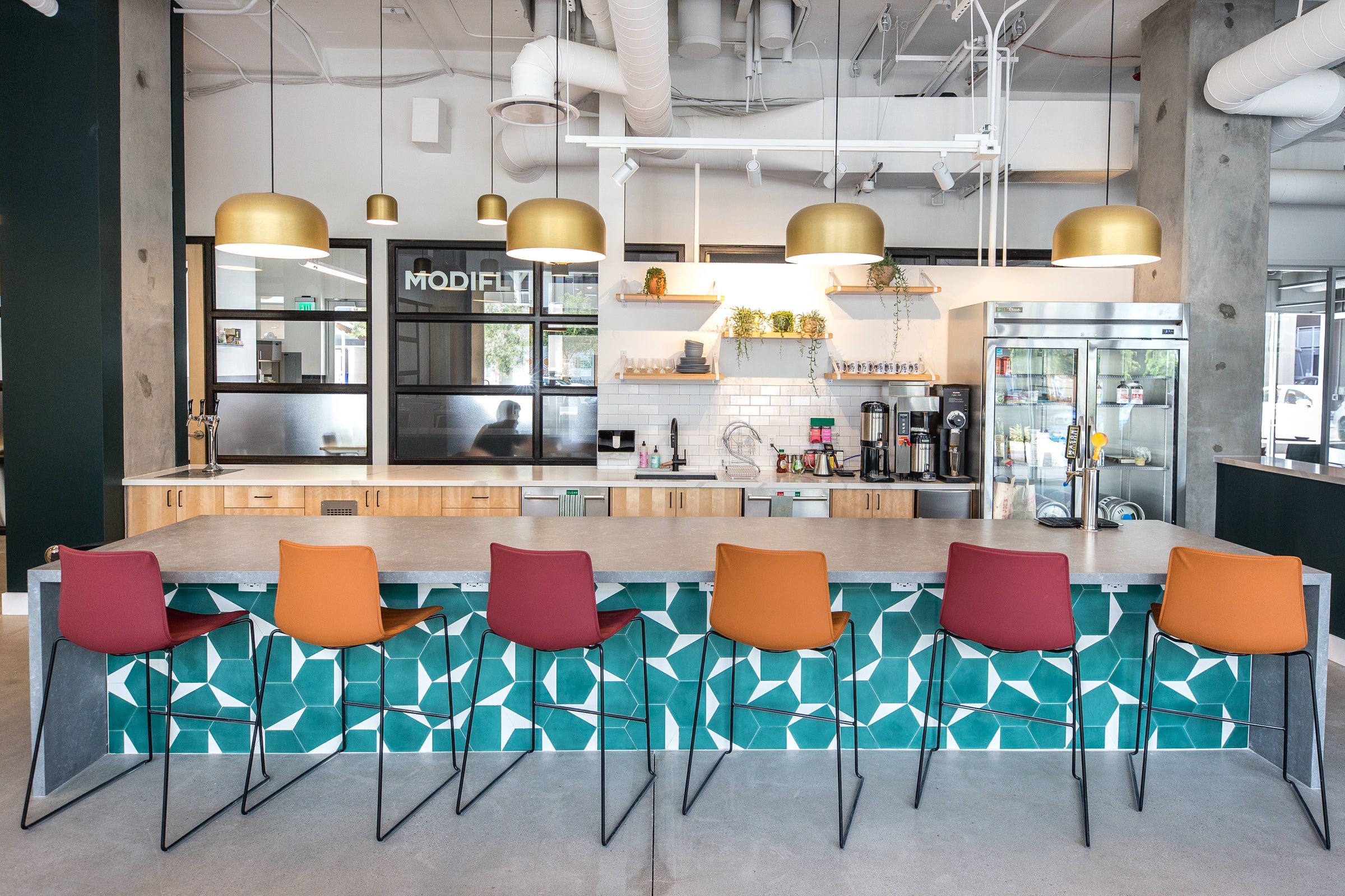 kitchen with a table and chairs at the bar