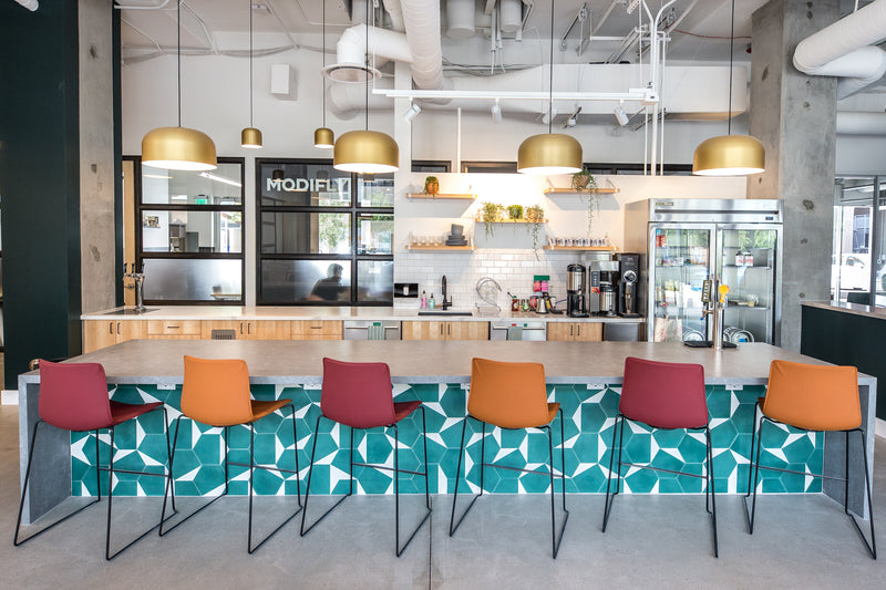 kitchen with a table and chairs at the bar