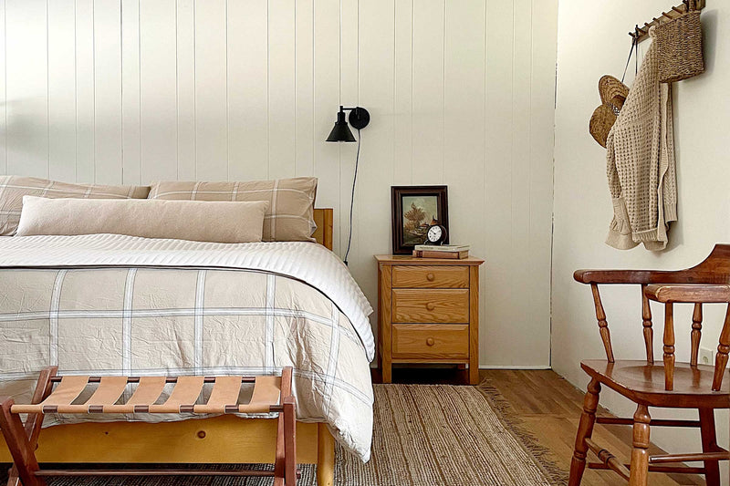 A cozy bed in a cabin.