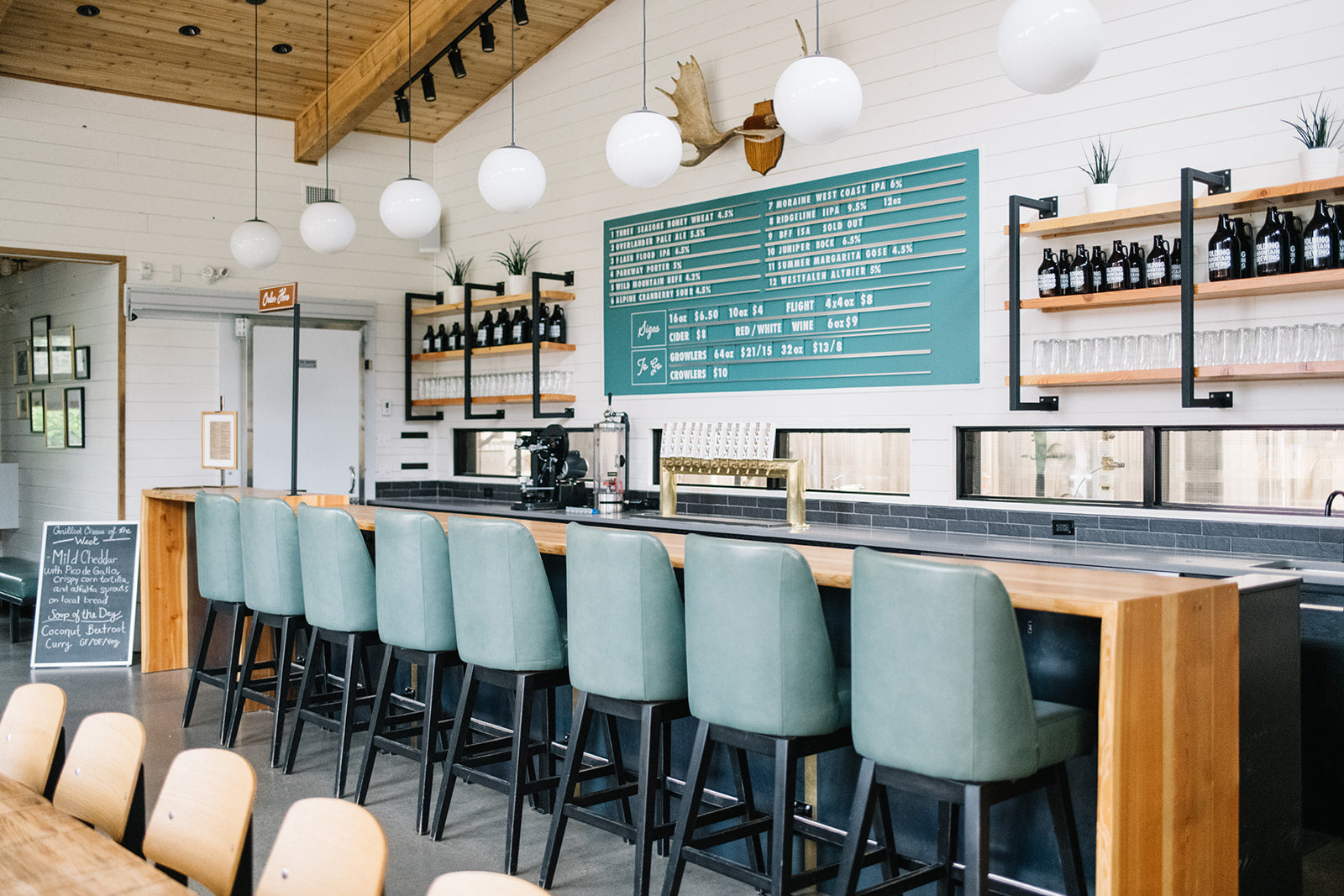 coffee shop with blue chairs and ceiling light fixtures