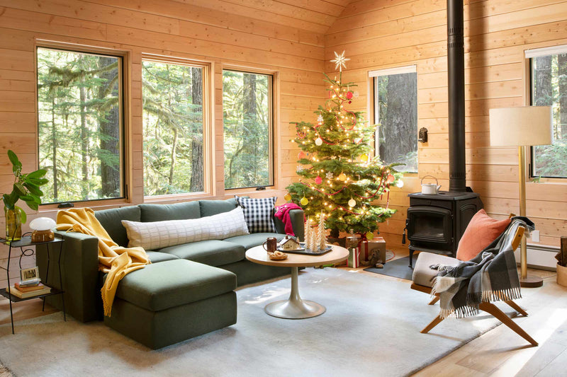 Living room in a cozy cabin decorated for the holidays.
