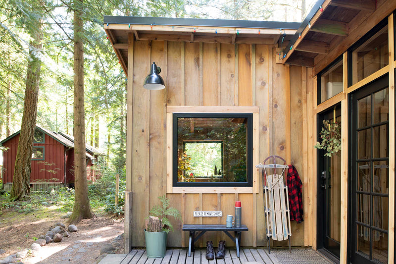 Outside of a modern cabin. 