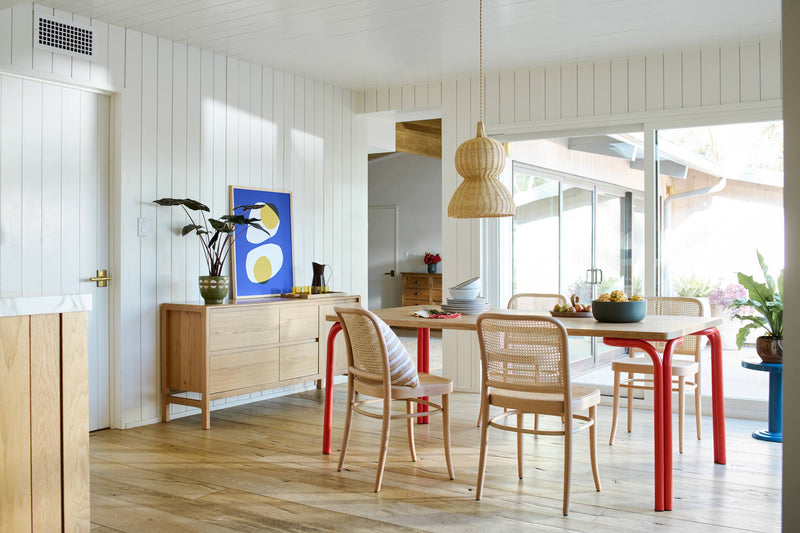 Textured handwoven pendant in a dining room. 