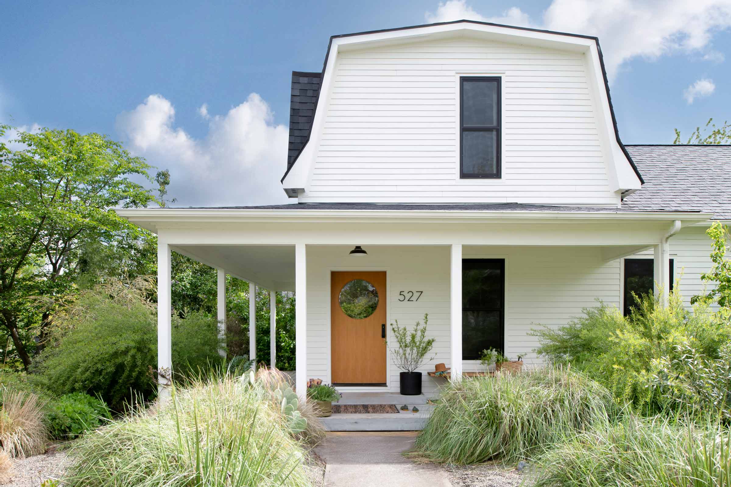 White house with a factory light fixture.