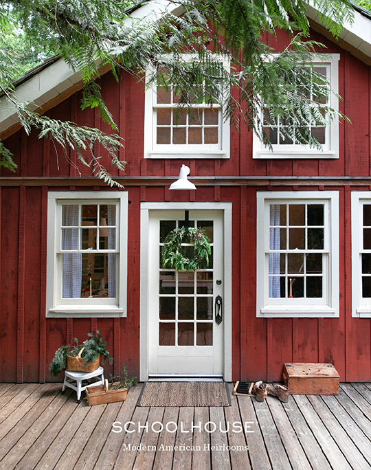 Outside of red house with wreath on door