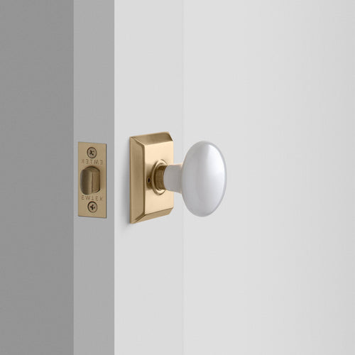 Freeport Small Backplate Doorset with Porcelain Knob - Antique Brass:hover